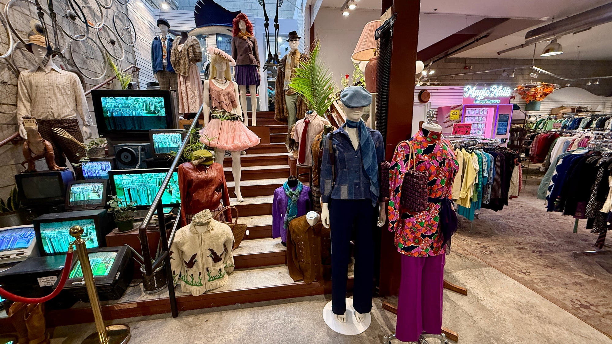 Interior of Public Butter Vintage store with mannequins and displayed clothes.